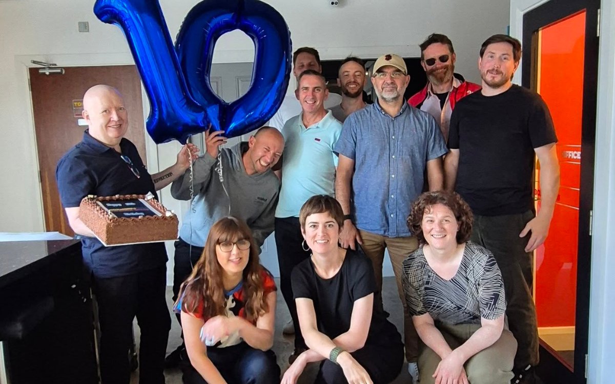 Boxworks members celebrating 10 years of the coworking space on Patrick Street, Waterford, with a giant number 10 balloon